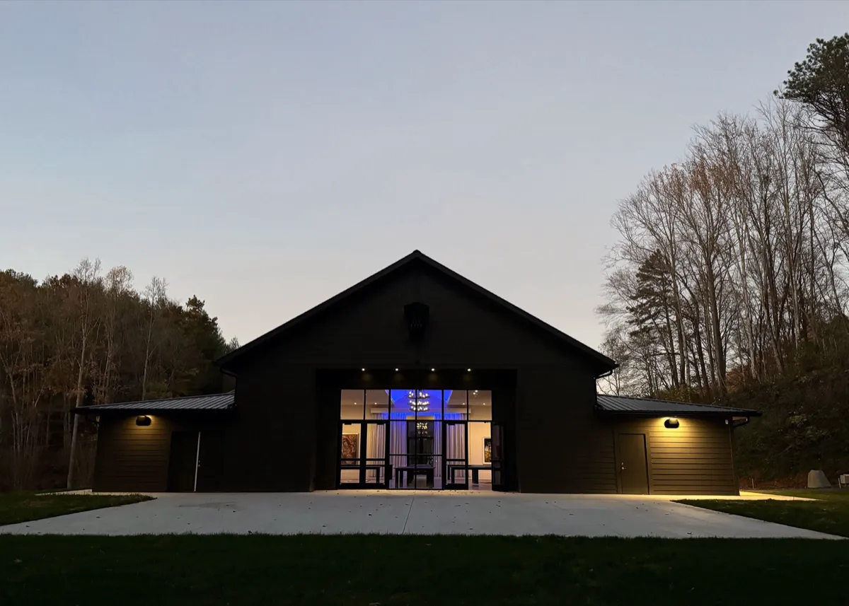 The reception gallery glowing at dusk