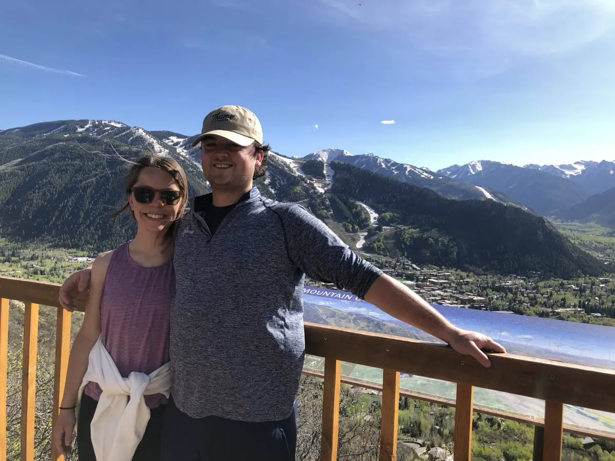 Deck selfie with the mountains stacked behind