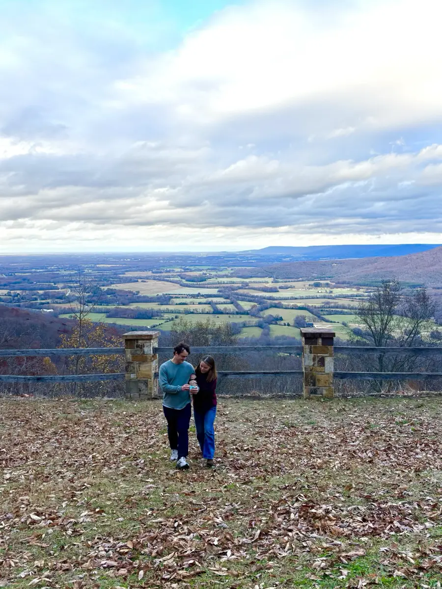 The two of us, very small, at a stone overlook above the valley