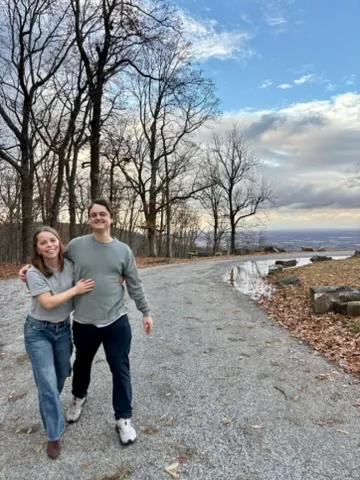 Shelby and Hobey walking a gravel overlook road in late fall